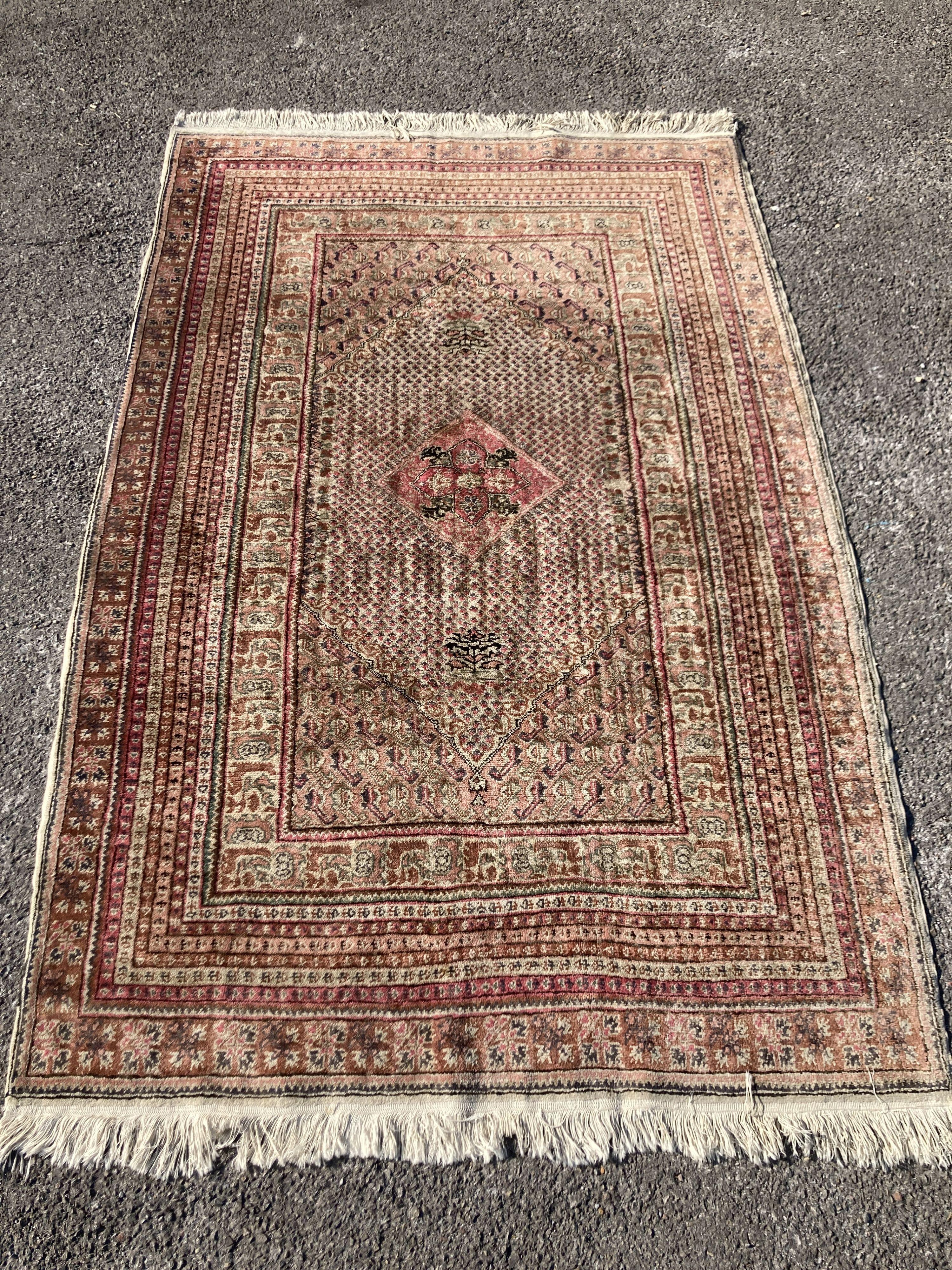 A North West Persian red ground rug, decorated with Saz leaf field, 190 x 125cm